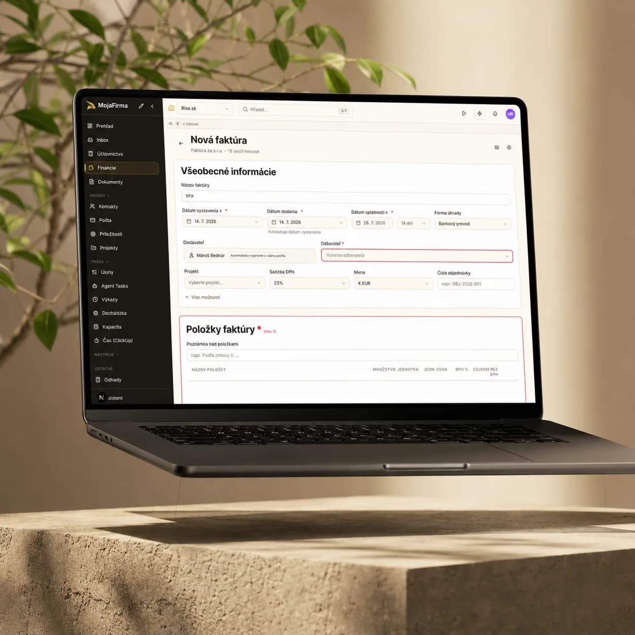 MojaFirma new invoice form on a laptop